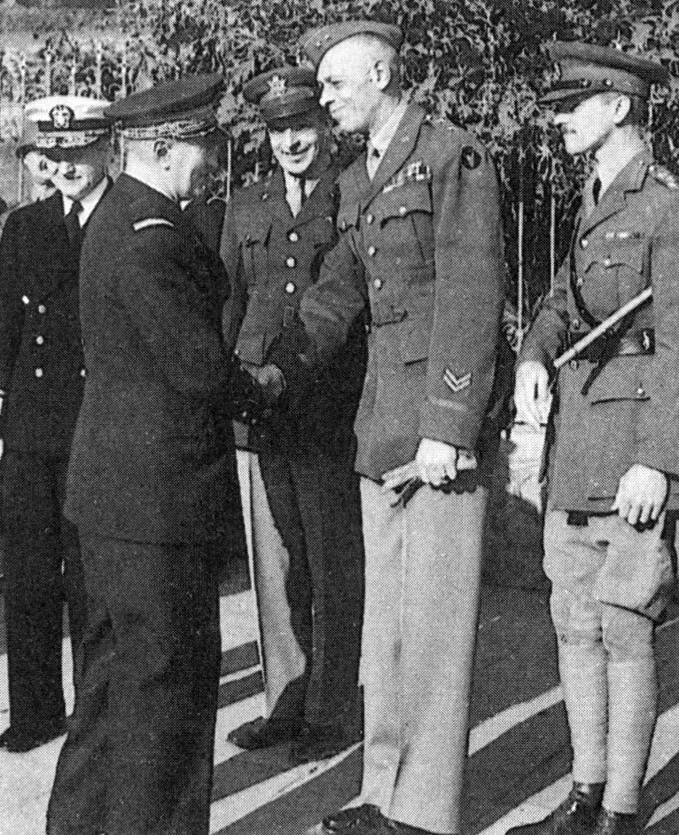 Darlan shaking hands with Major General Charles W. Ryder