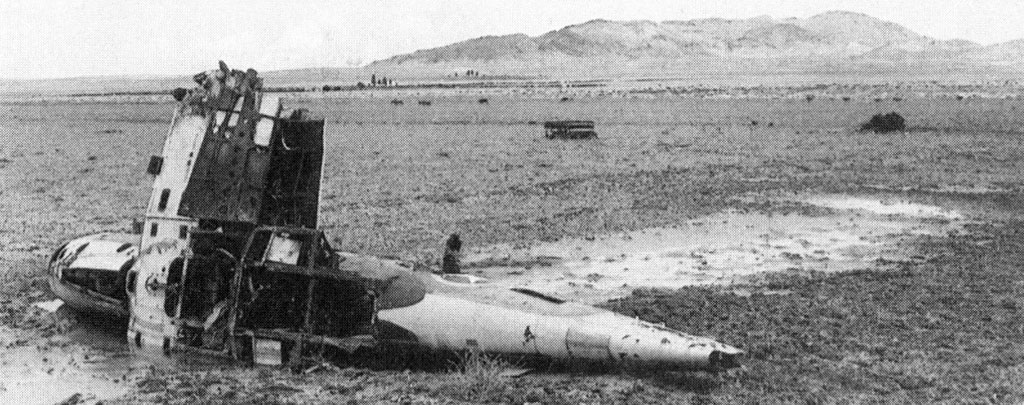 The wreckage of an American P-38 fighter near Sidi bou Zid. In the distance looms Djebel Lessouda, where John Waters was captured and Robert Moore escaped with part of his battalion.