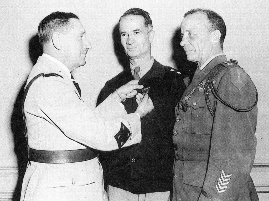 General Louis-Marie Koeltz, commander of the French XIX Xorps, presents the Croix de Guerre to Terry Allen (center) and Ted Roosevelt for their valor in the Tunisian campaign.