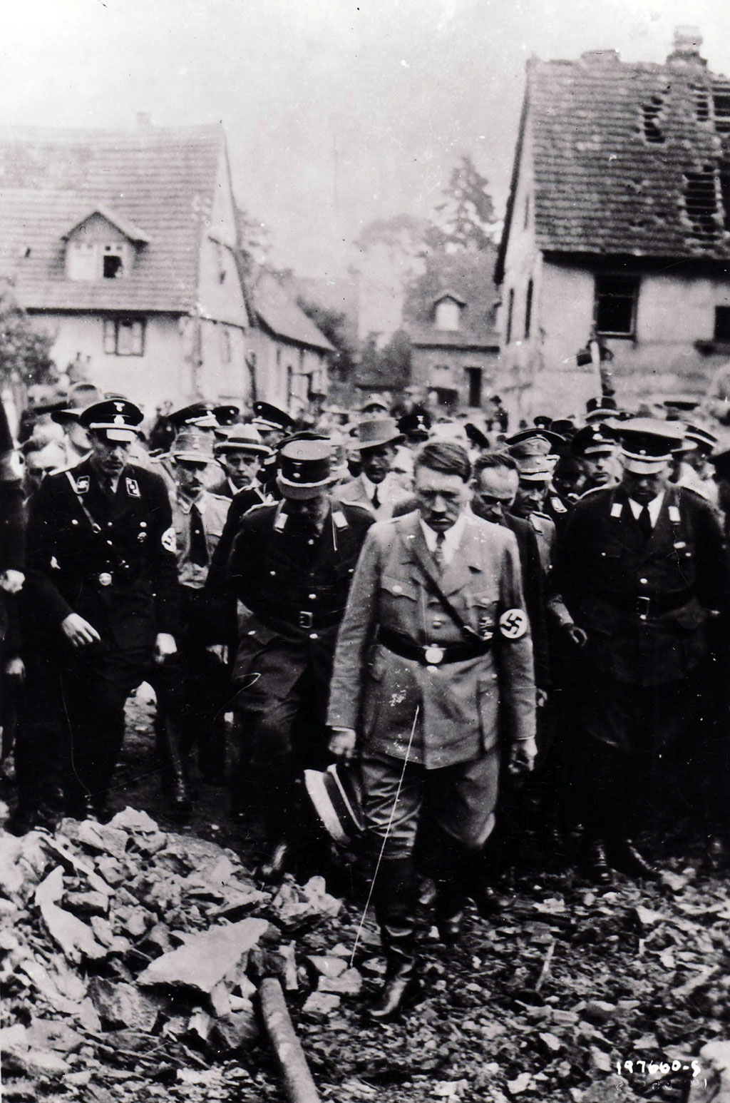 Adolf Hitler examines wreckage in an undated German photo captured by the U.S. Army on the Western front. For the first and only time since the Germans overran Paris four years earlier, the Führer in mid-June of 1944 would return to France to confer with his commanders in Margival about the Allied invasion.