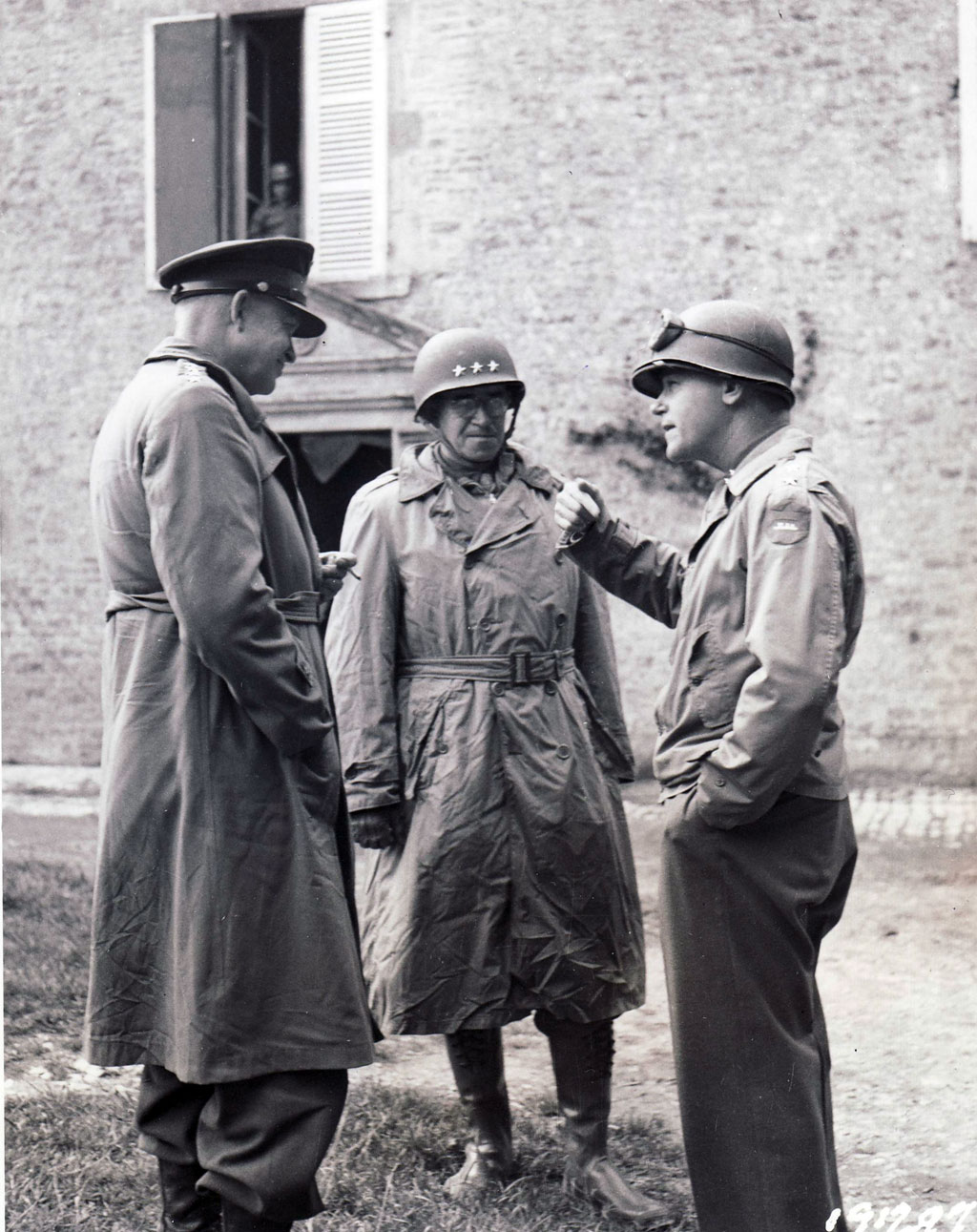 Eisenhower and Bradley listen to Major General J. Lawton Collins, right, commander of the U.S. VII Corps, shortly after the capture of Cherbourg.
