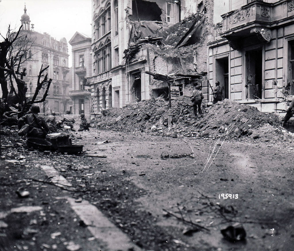 GIs from the 1st Infantry Division battle through central Aachen on October 17, 1944, a day before German defenders finally capitulated.