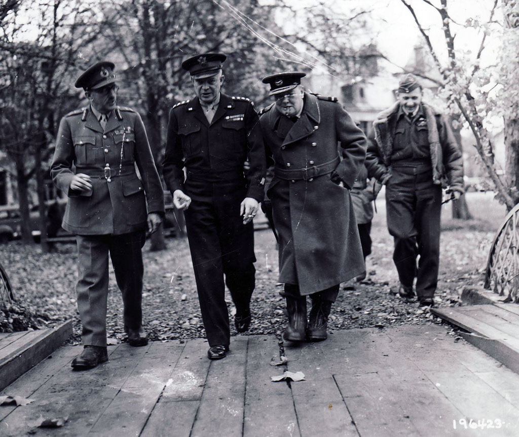 The high command contemplates a winter campaign in northern Europe. Conferring in mid-November at the supreme commander's forward headquarters in Reims are, left to right, Field Marshal Sir Alan Brooke, chief of the Imperial General Staff; Eisenhower; Prime Minister Winston S. Churchill; Tedder. 
