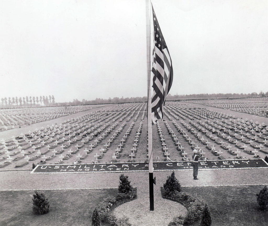 A bugler blows Taps at the close of Memorial Day ceremonies in May 1945 at the U.S. military cemetery at Margraten, Holland.